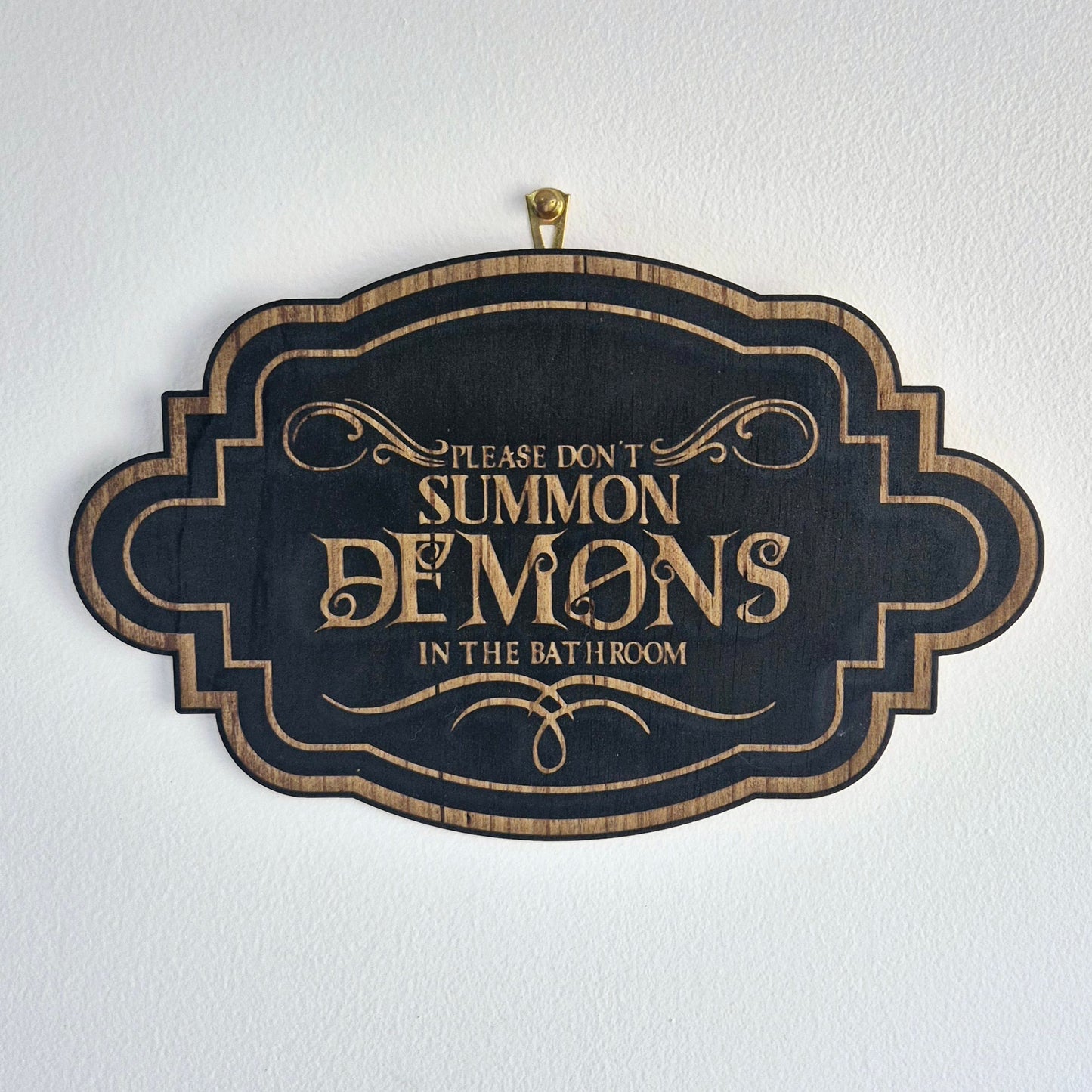 Demons Bathroom Sign